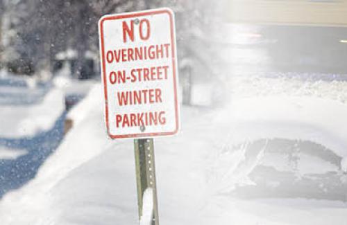 Photo of sign stating "NO OVERNIGHT ON-STREET WINTER PARKING"