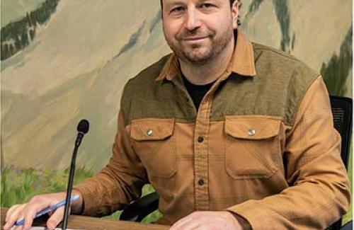 Photo of Spencer In a City Council Meeting