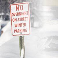 Photo of sign stating "NO OVERNIGHT ON-STREET WINTER PARKING"