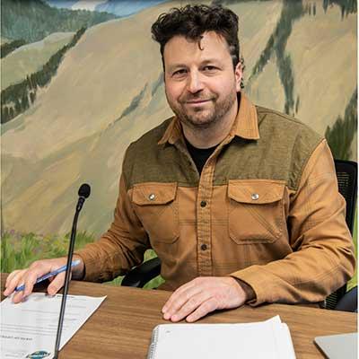 Photo of Spencer In a City Council Meeting